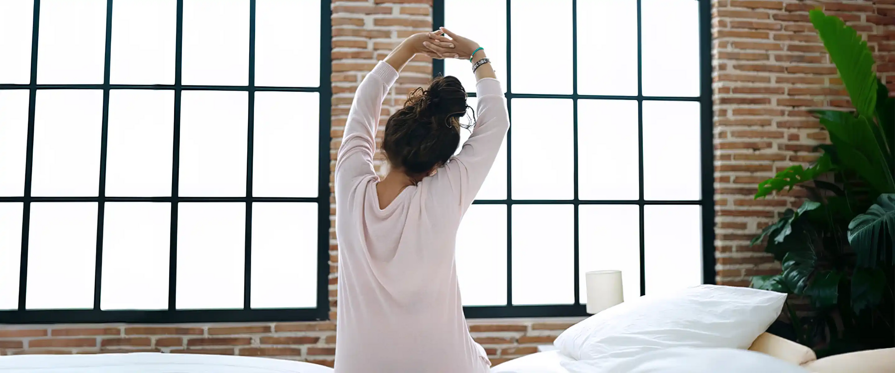 woman waking up stretching