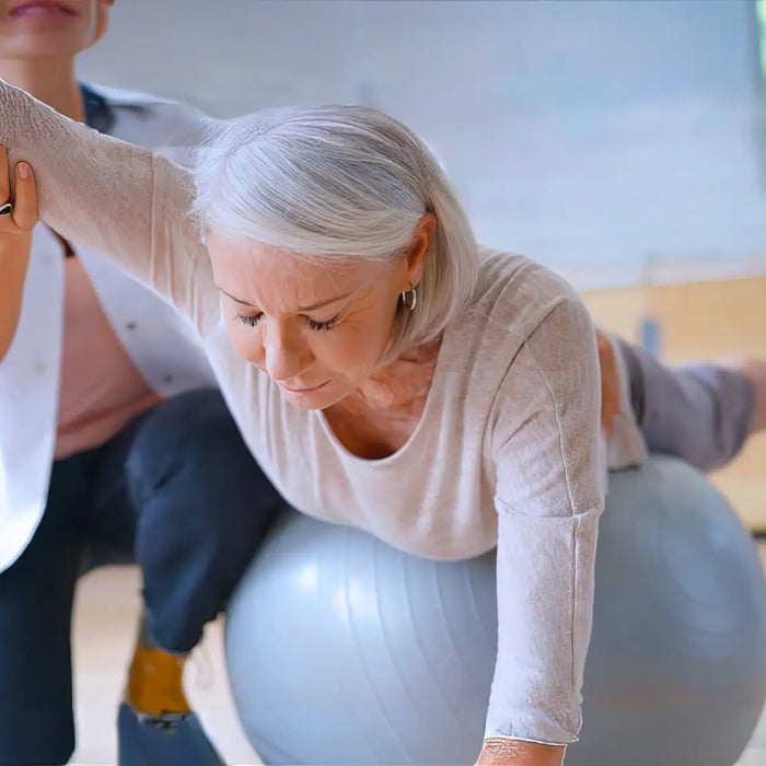 Senior Woman Exercising Her Physiotherapist