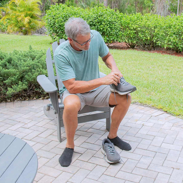 Senior preparing shoes to run