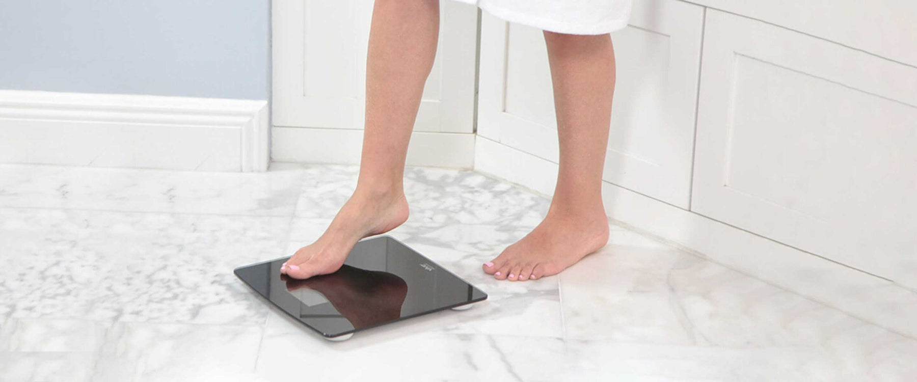 woman weighing herself