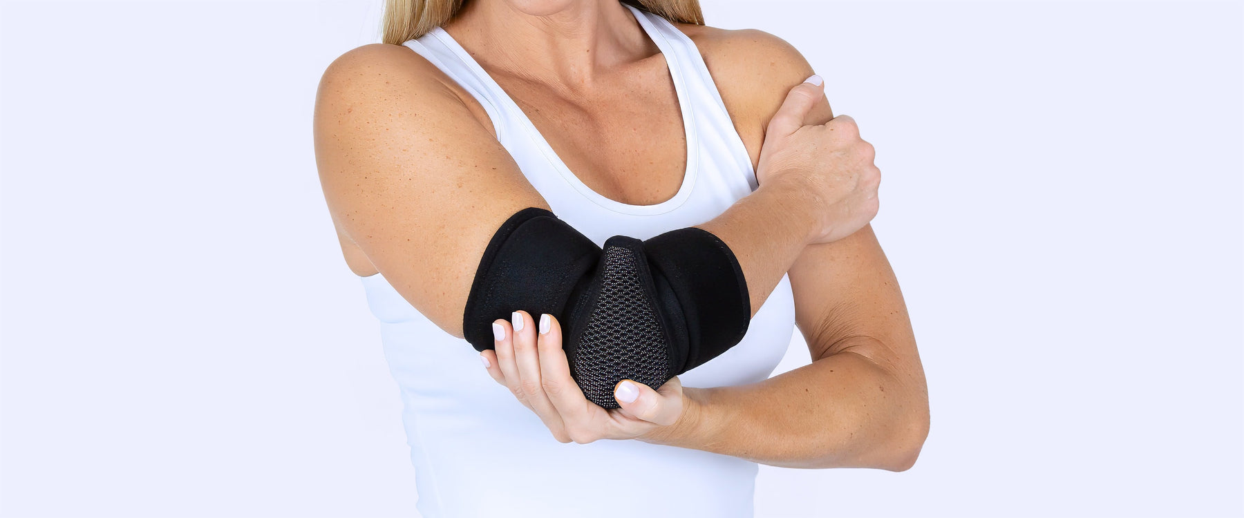 Woman wearing elbow brace