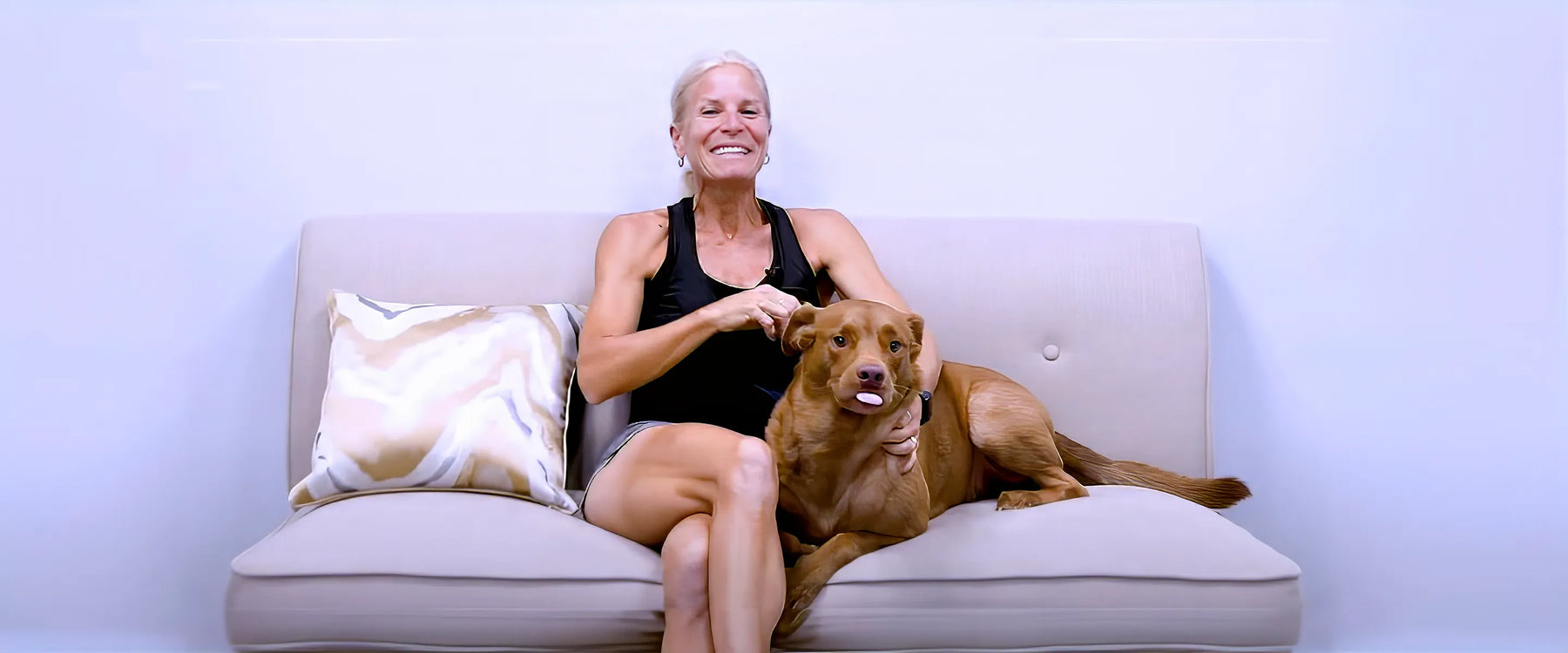 Woman and dog on a couch
