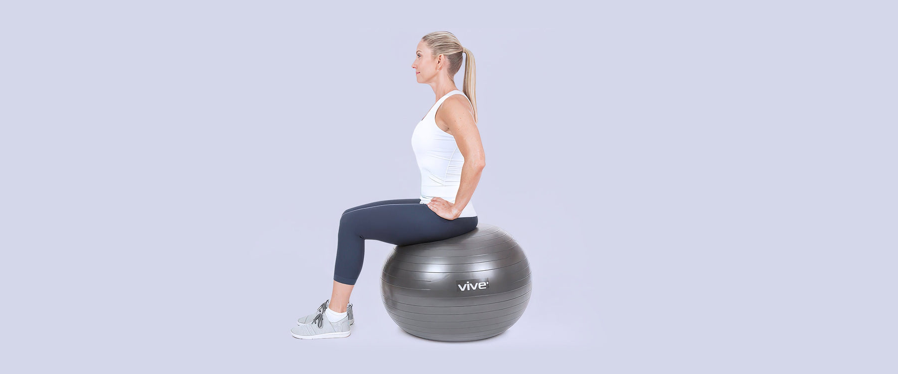 Woman sitting on a yoga ball