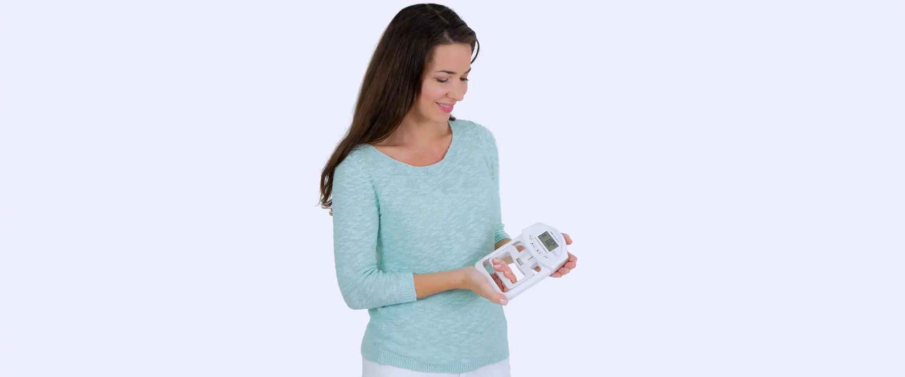 Woman holding grip strengthener