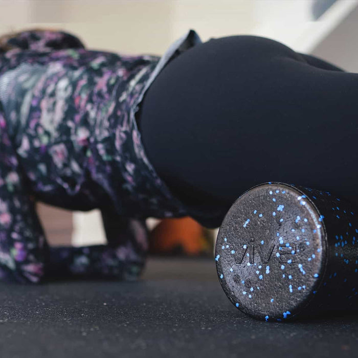 Woman using foam roller massage