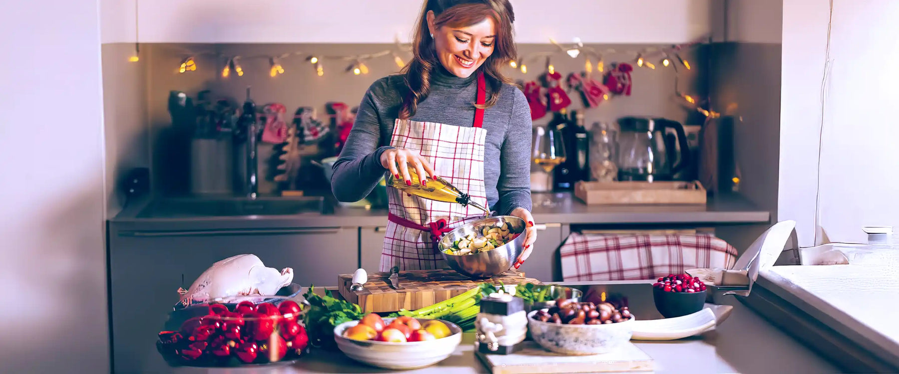 Young Woman Cooking in the kitchen. Healthy Food for Christmas