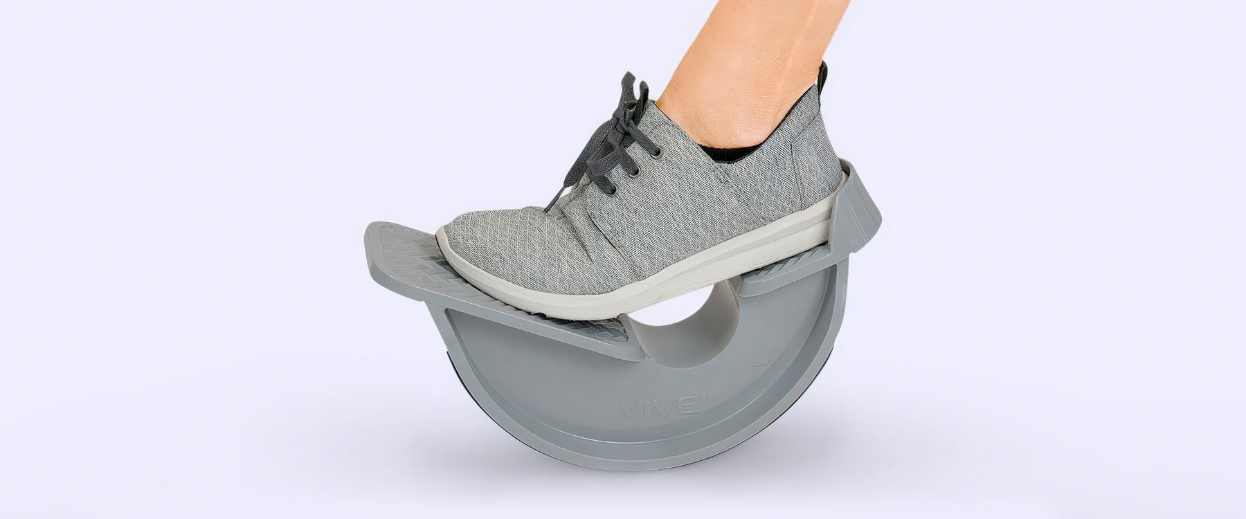 Left foot stepping on a calf stretcher