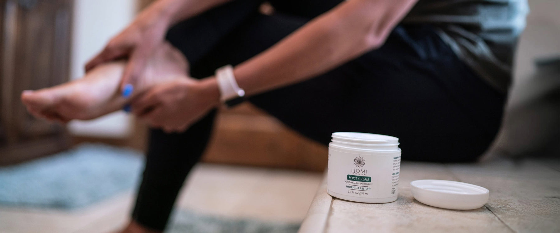 woman using foot cream