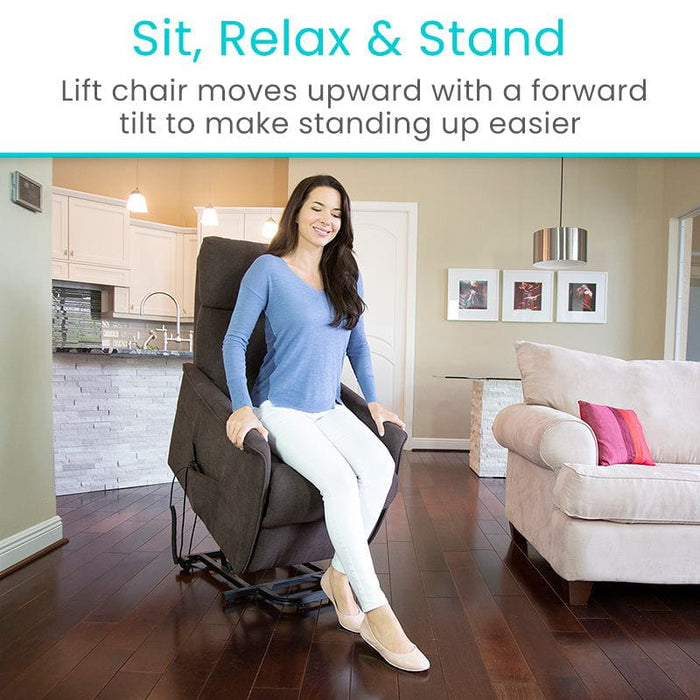 Lift chair with a forward tilt, making standing easier, shown being used by a woman sitting and standing comfortably.