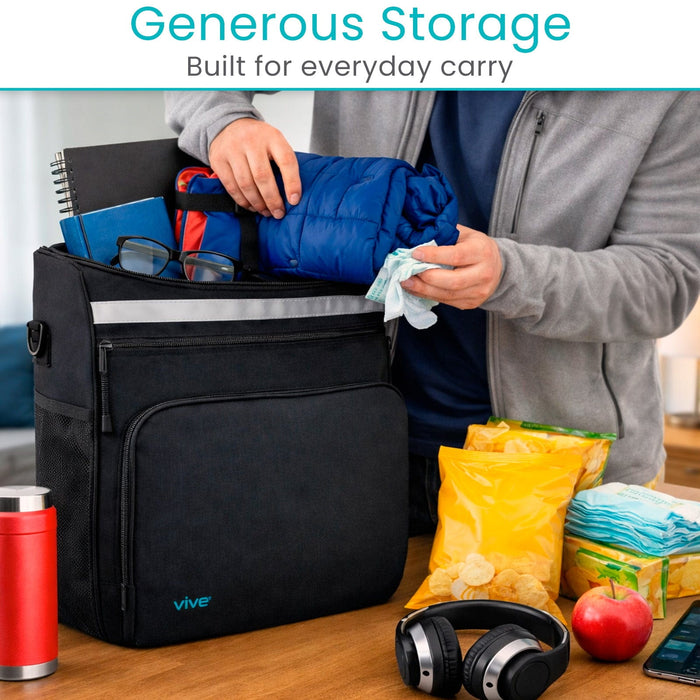 Person organizing items into a black bag XL wheelchair bag by Vive