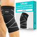 pair of black Vive compression knee sleeves with straps, displayed on a model. The packaging shows the product name and size 'LARGE'.