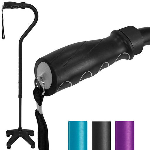 A black SureWalk Quad Cane with a four-pronged base standing independently. The cane is made from aluminum and has an ergonomic grip.