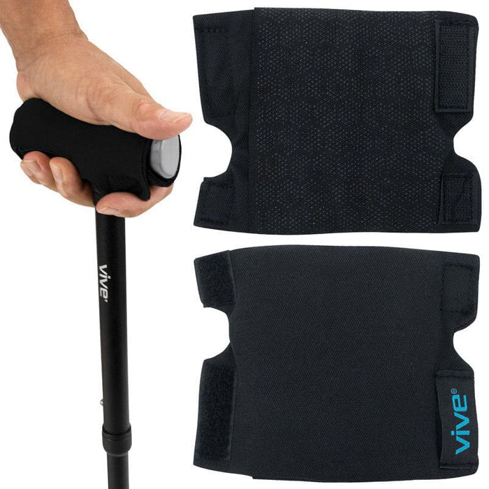 A set of two black cushioned cane handle grip covers with a honeycomb texture, designed to fit over the handle of a cane for enhanced comfort.