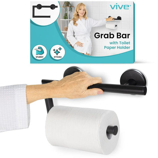 Vive grab bar toilet paper holder, silver, wall-mounted with toilet paper, shown in use by a person.