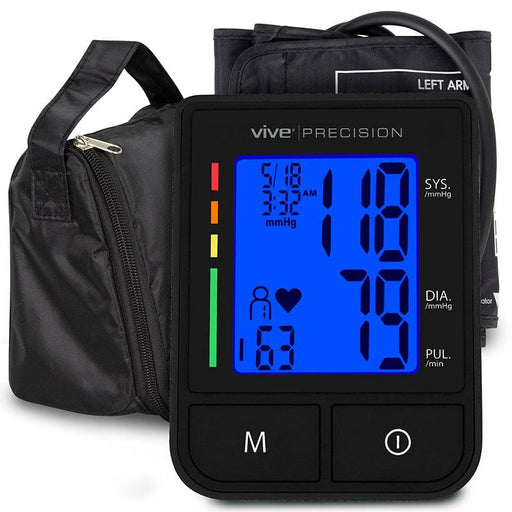 A black Vive Precision Compact Blood Pressure Monitor with a bright LCD screen displaying readings, alongside a micro-USB charging cable and a soft-sided storage case.
