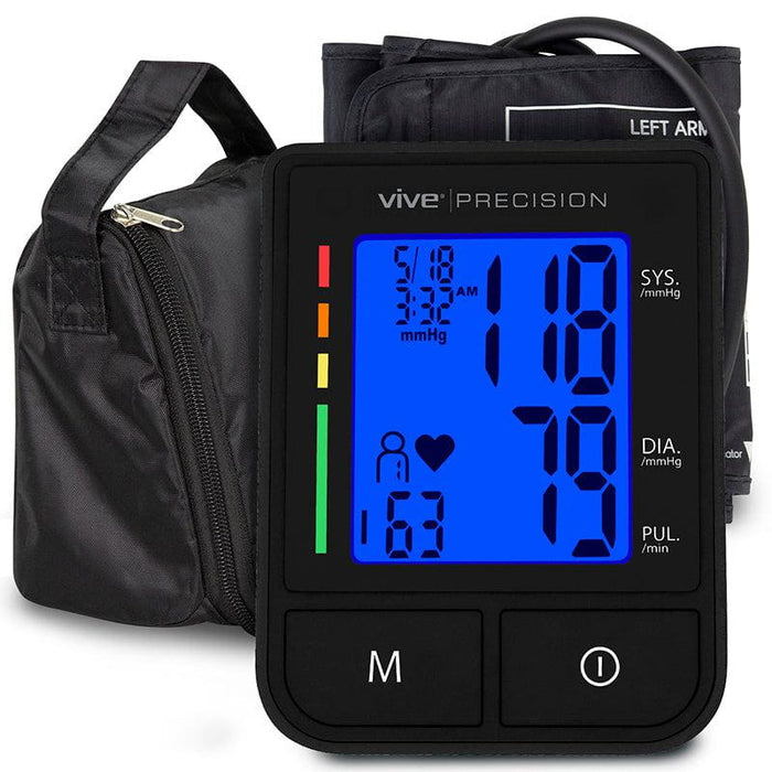 A black Vive Precision Compact Blood Pressure Monitor with a bright LCD screen displaying readings, alongside a micro-USB charging cable and a soft-sided storage case.